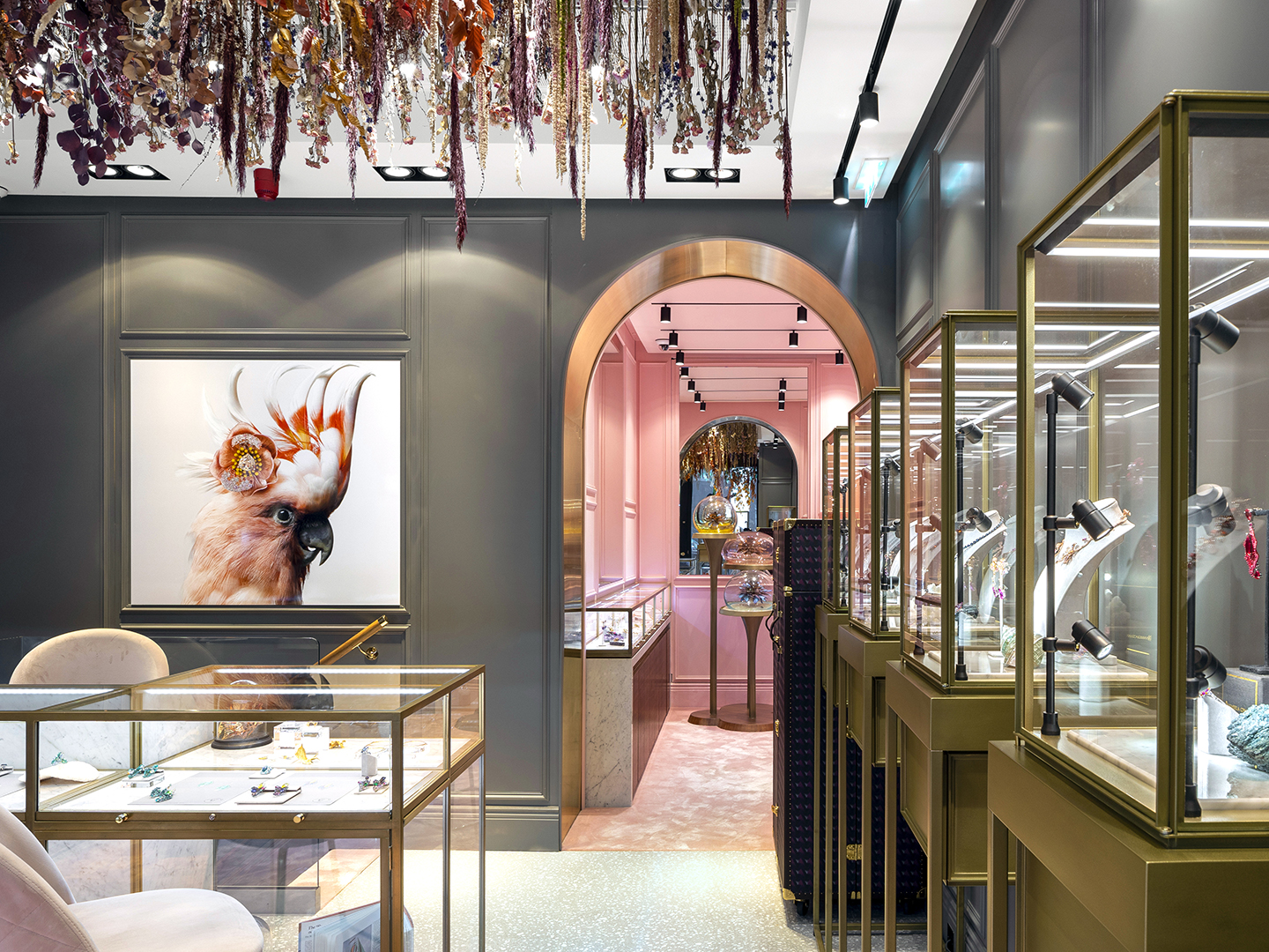 Anabela Chan boutique interior showcasing jewelry displays beneath a suspended dried-flower installation.