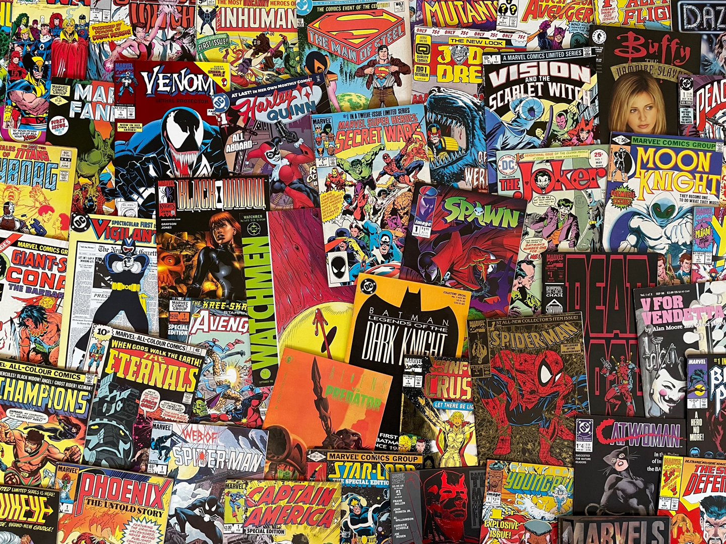 Collage of vintage superhero comic book covers serving as a decorative backdrop